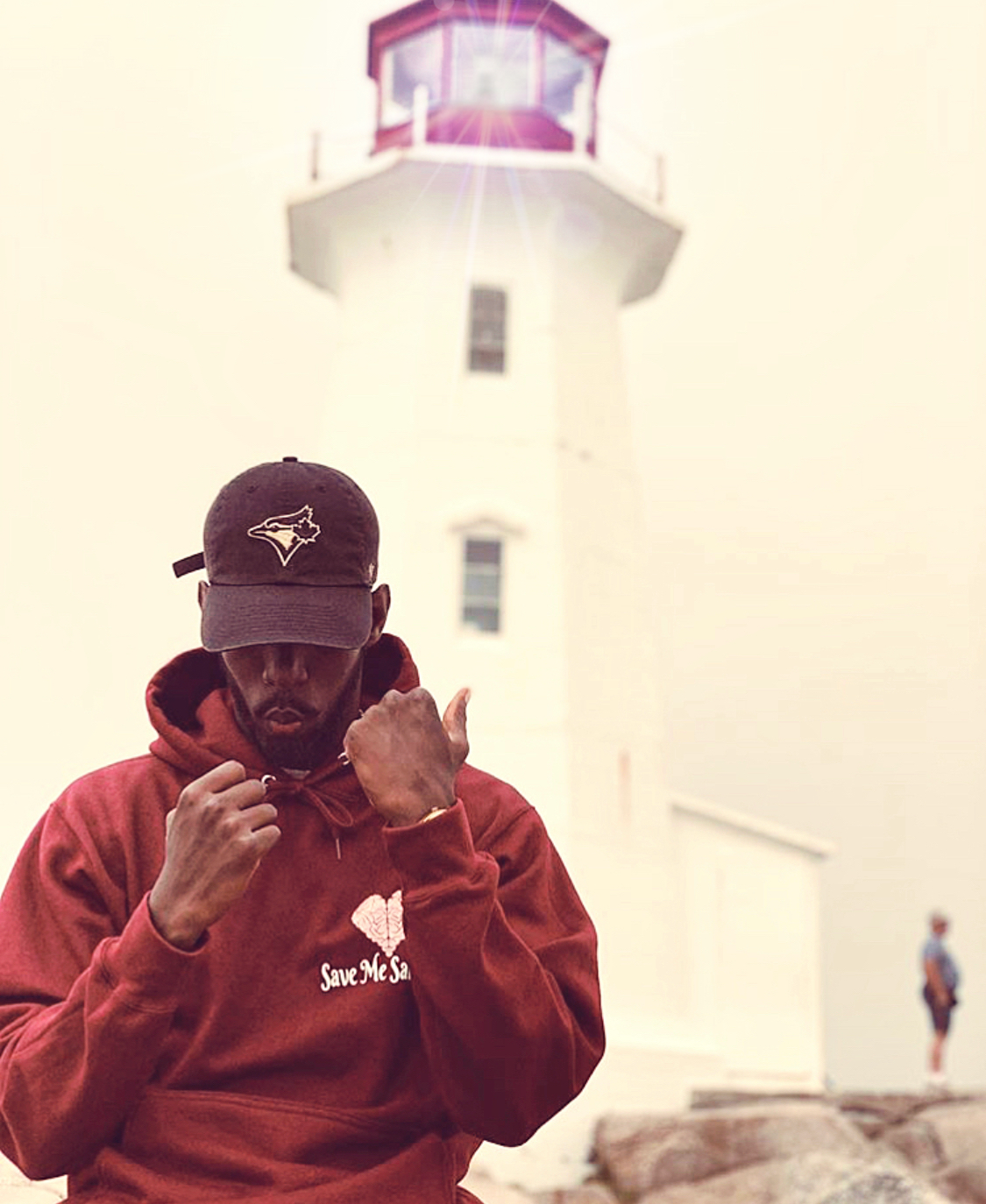 Aime Hirwa in front of Peggy's Cove 
